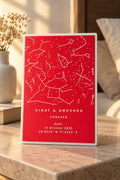 Red and white custom star map desk plate on a bedside table